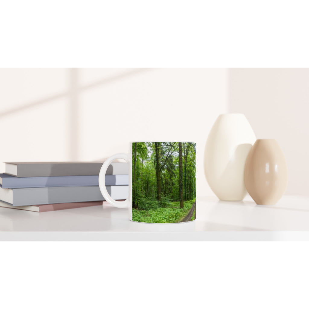 Minimalist nature photography of a lone tree in the mist, printed on a premium white ceramic mug for a calm and mindful coffee or tea ritual.